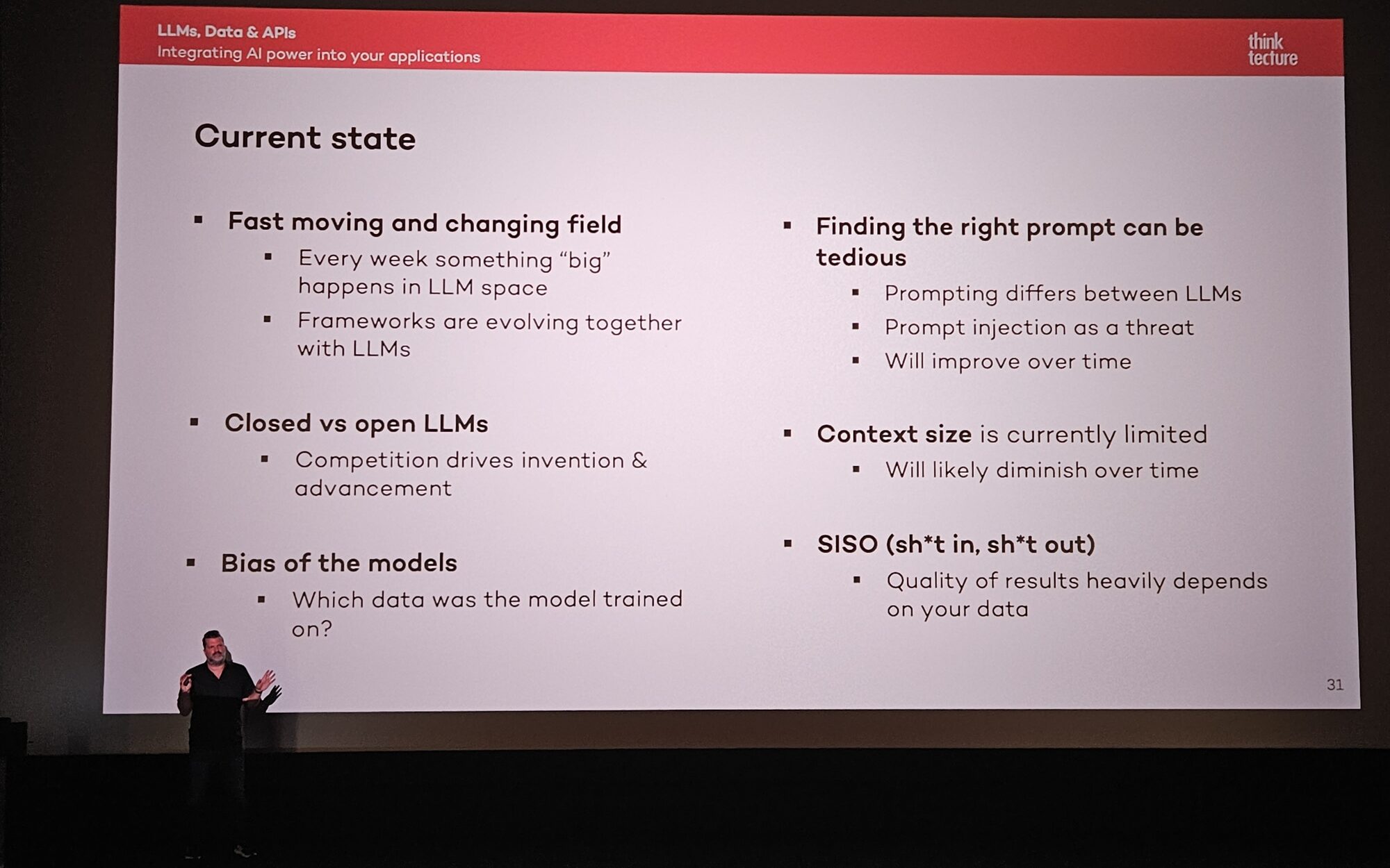 Slide with Christian Weyer standing in front showing bullet points of the current state of LLMs: Fast moving and changing field, Closed vs open LLMs, Bias of the models, Finding the right prompt can be tedious, Context site is currently limited, SISO (Shit in, shit out)